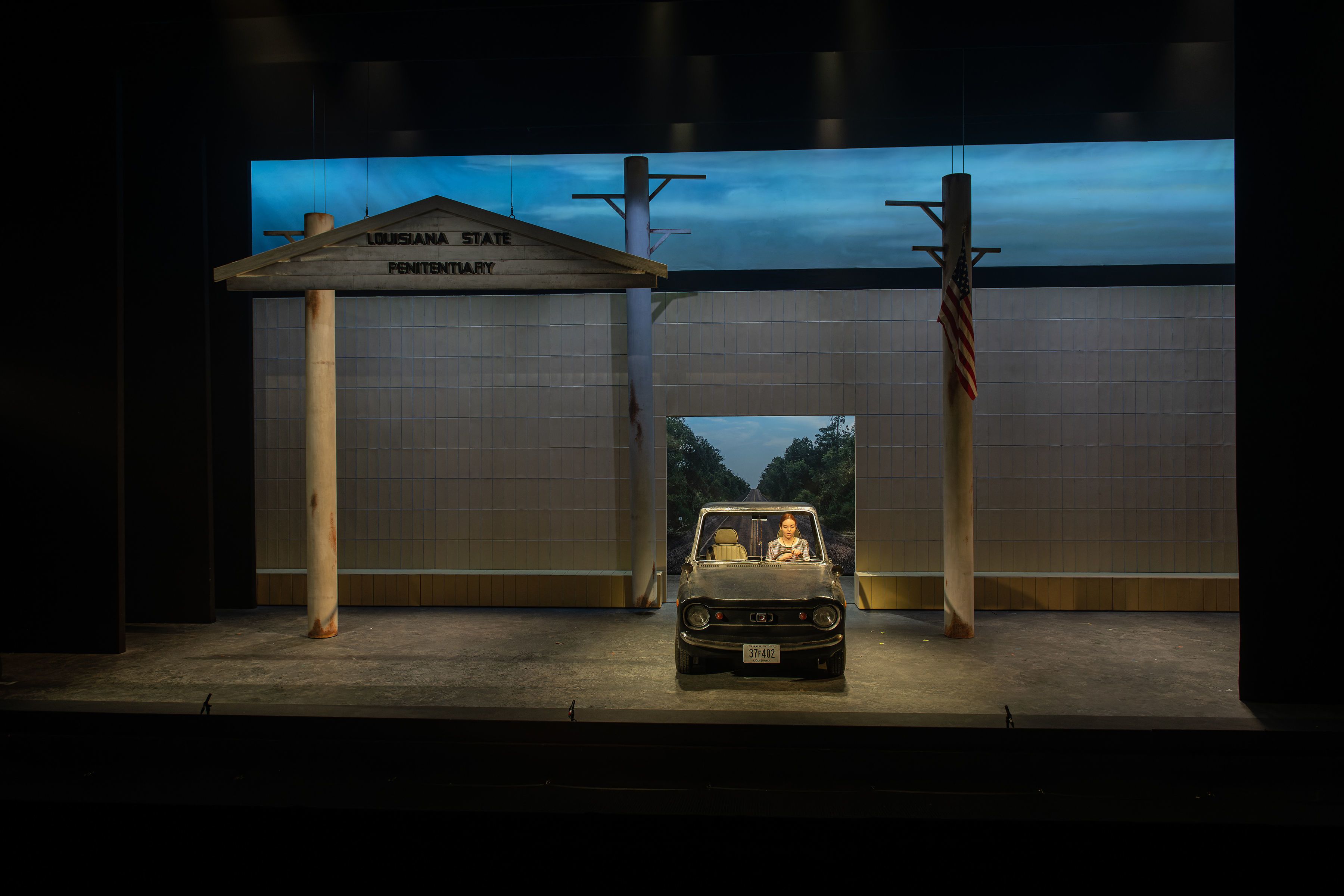 Woman driving a car on stage